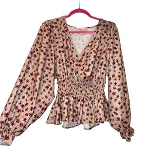 New boutique mauve floral surplice peplum blouse for sale! Size small. NWOT